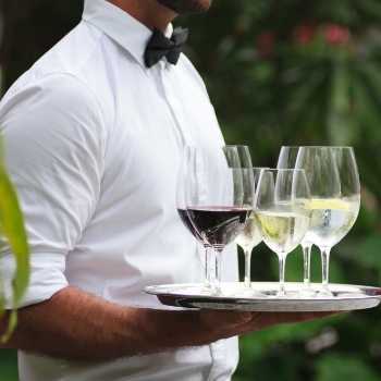 Image: Waiters dressed in white shirts and black pants wait to serve  High-Res Stock Photo 