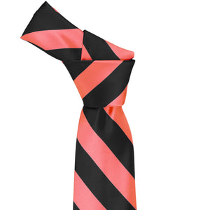 Knot on a coral and black striped tie