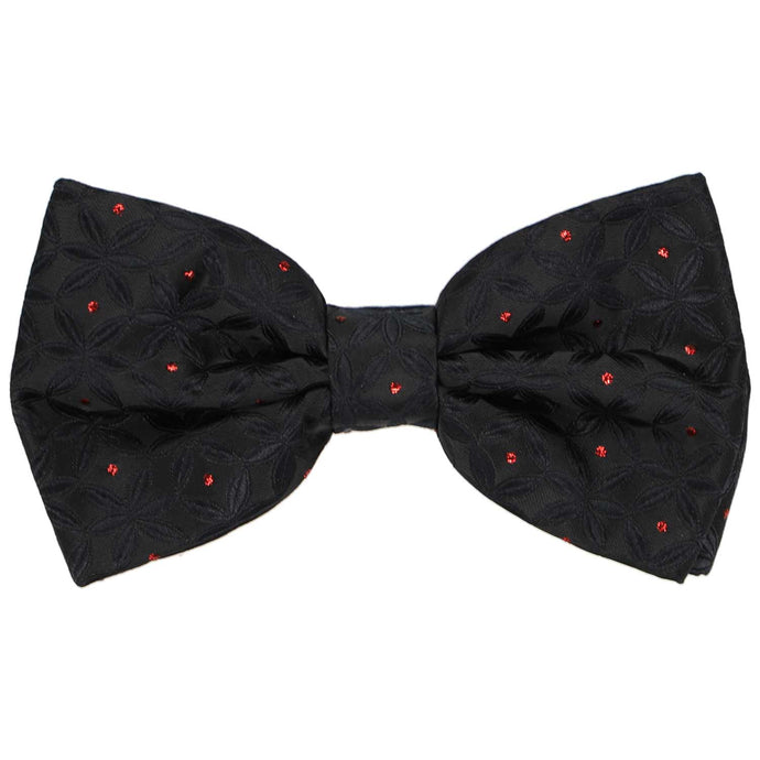 A pre-tied textured black bow tie with red metallic polka dots