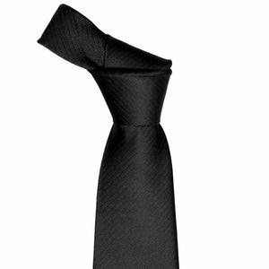 Knot on a black herringbone silk tie