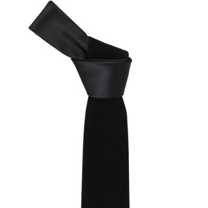 Knot on a black velvet necktie