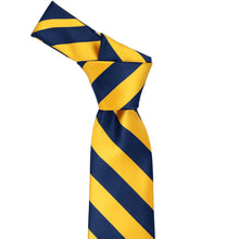 Load image into Gallery viewer, Knot on a blue velvet and golden yellow striped tie