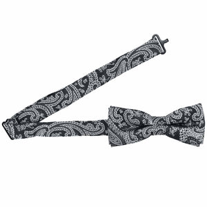 Open band collar on a boys black paisley bow tie