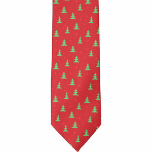 The front of a boys red and green Christmas tree tie