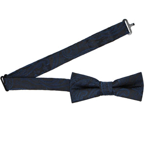 Open band collar on a boys' navy blue paisley bow tie