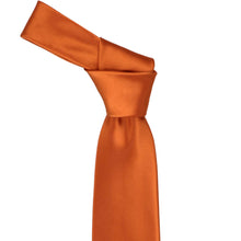 Load image into Gallery viewer, The knot on a burnt orange necktie