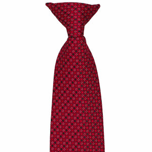 The pre-tied knot on a crimson red square pattern tie