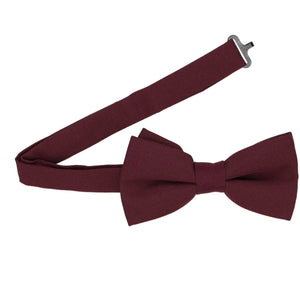 Open band collar on a dark burgundy matte bow tie