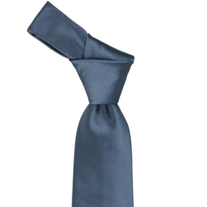 Knot on a dusty blue tie