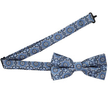 Load image into Gallery viewer, Open band collar on a muted blue floral abstract bow tie