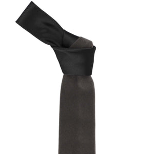 Knot on a gray velvet necktie