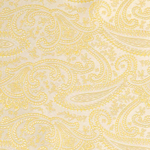 Closeup of a soft yellow paisley pattern