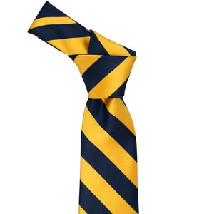 Knot on a navy blue and golden yellow striped tie