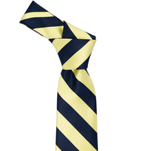 Load image into Gallery viewer, Knot on a light yellow and navy blue striped tie