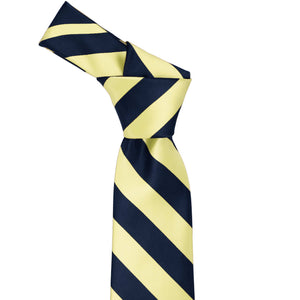 Knot on a light yellow and navy blue striped tie