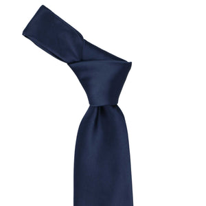 Knot on a navy blue tie