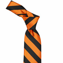 Load image into Gallery viewer, The knot of an orange and black striped tie