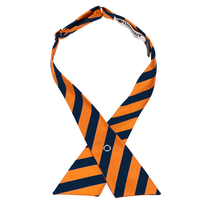 An orange and navy blue striped crossover tie with a metal snap