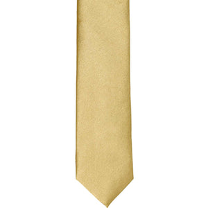 The front of a skinny pale gold skinny tie