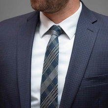 Load image into Gallery viewer, Man wearing a blue plaid tie with a suit