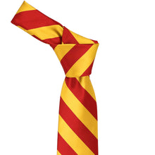 Load image into Gallery viewer, Knot on a red and golden yellow striped tie