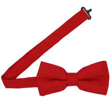 Load image into Gallery viewer, Open band on a red matte bow tie