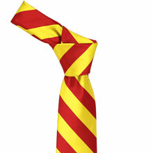 Load image into Gallery viewer, Knot on a red and orange striped necktie