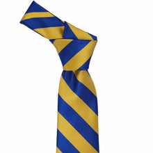 Load image into Gallery viewer, Knot on a royal blue and gold striped tie