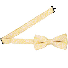 Load image into Gallery viewer, Open band collar on a soft yellow paisley bow tie