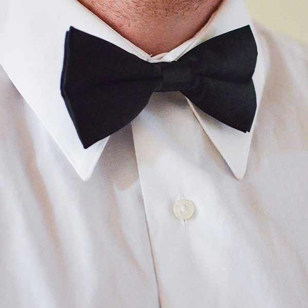 Man wearing a black bow tie