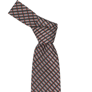 Knot on a terracotta plaid tie