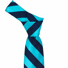 Load image into Gallery viewer, Knot on a turquoise and navy blue striped tie