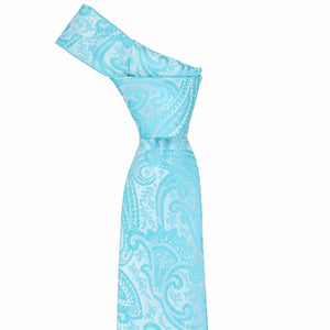 Knot on a tied turquoise paisley necktie