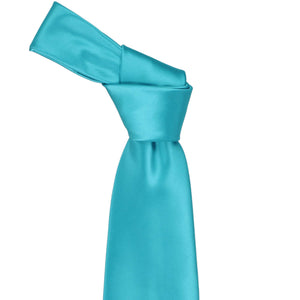 Knot on a turquoise necktie