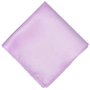 A light purple pocket square, folded into a diamond shape
