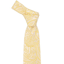 Load image into Gallery viewer, Knot on a tied yellow paisley necktie