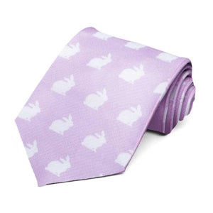 A rolled lavender tie with a white bunny pattern