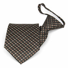 Load image into Gallery viewer, Folded front view of a brown and black plaid zipper tie