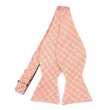 Load image into Gallery viewer, An untied light orange self-tie bow tie with thin white and blue plaid stripes