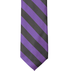 The front of a purple and gray striped tie, laid out flat