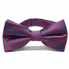 Load image into Gallery viewer, Front view of a red and blue chevron pattern bow tie