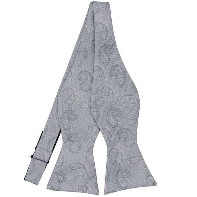 An untied silver tone-on-tone paisley self-tie bow tie